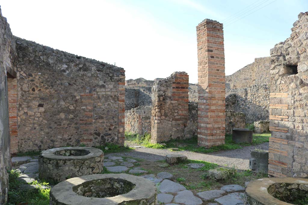 IX.3.12 Pompeii. December 2018. 
Looking west across bakery towards entrance doorway, on left, and rectangular pilaster, on right.
Photo courtesy of Aude Durand.
