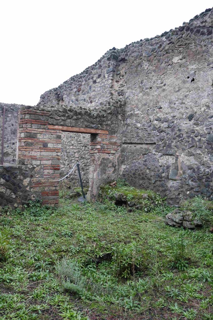 IX.3.13 Pompeii. December 2018. 
Looking towards south-west corner of atrium with hearth and bench against west wall.
Photo courtesy of Aude Durand.
