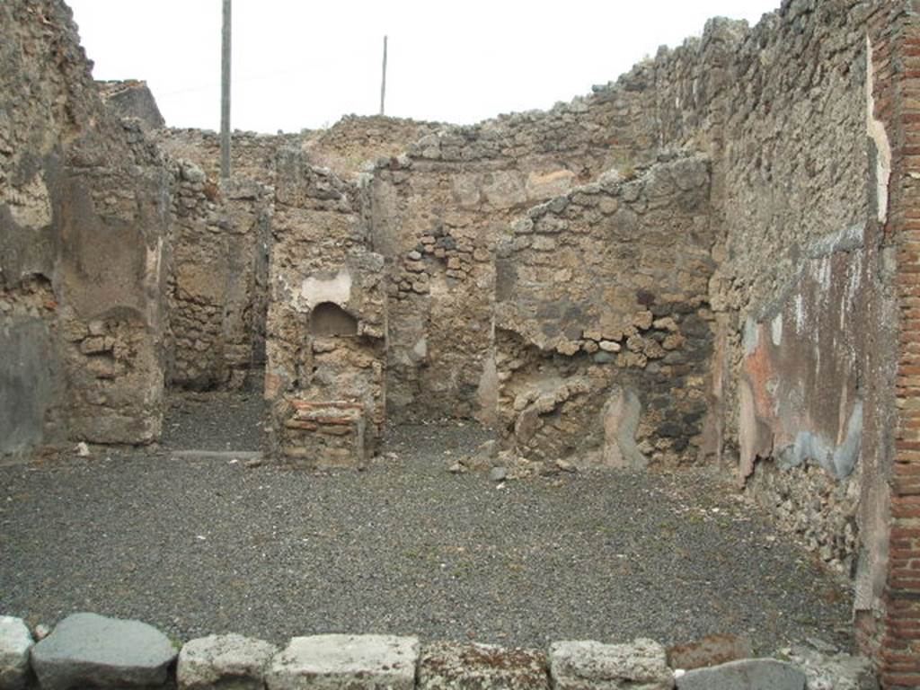 IX.3.14 Pompeii. May 2005. Looking towards north wall, north-east corner and east wall of shop-room.