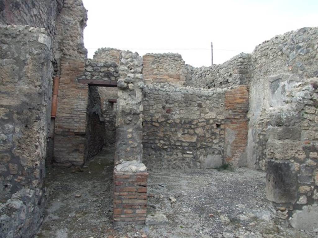 IX.3.17 Pompeii. March 2009. Corridor with steps to upper floor, (on left), and rear room, (on right).
