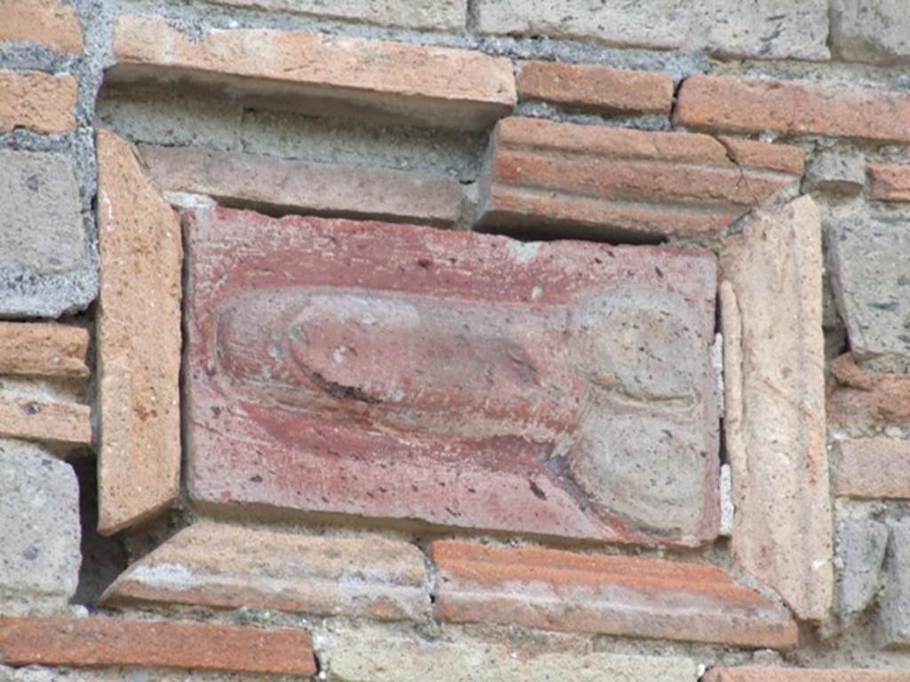 IX.5.1 Pompeii. December 2007. Terracotta wall plaque of phallus on wall outside IX.5.1.  