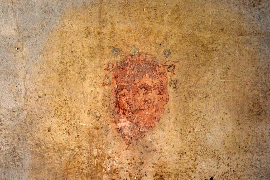 IX.5.6 Pompeii. May 2017. 
Room k, west wall in centre, mask of a bald Silenus on a white background, with garland of ivy, and a pointed beard.
Foto Christian Beck, ERC Grant 681269 DCOR.
