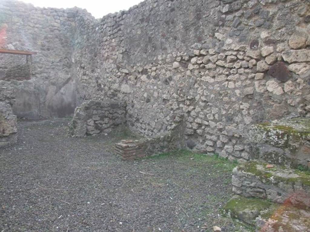 IX.5.8 Pompeii. December 2007. Looking south-west to rear room with window into IX.5.9. In the north-west corner of the west wall, on the right, can be seen three stone steps leading to the steps to upper floor.
