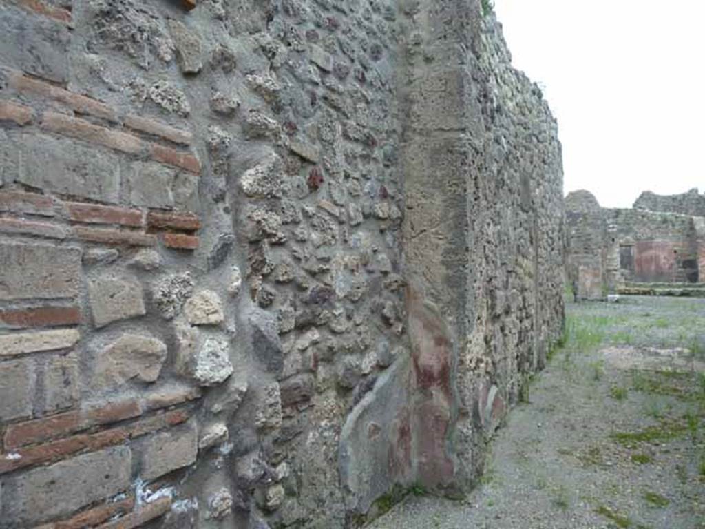 IX.5.9 Pompeii. May 2010. Looking south along east wall of entrance corridor.