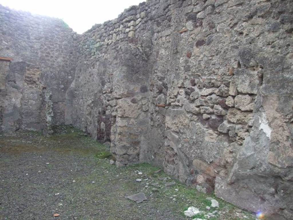 IX.5.10 Pompeii. December 2007. West wall of shop. In the south-west corner, at the rear, was the latrine behind a staircase to the upper floor.