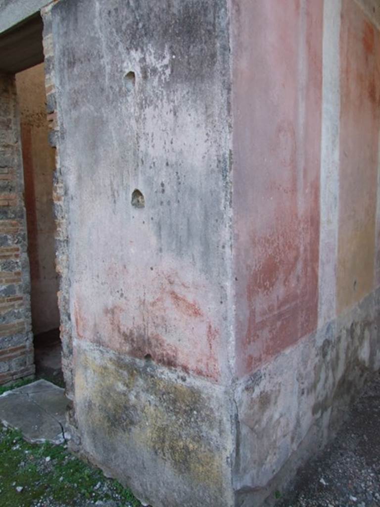 IX.5.11 Pompeii. December 2007. Pilaster on west side of atrium, between room 7 and room 8, the ala. On the right is the south-east corner, with red and yellow panels, of room 8. 
