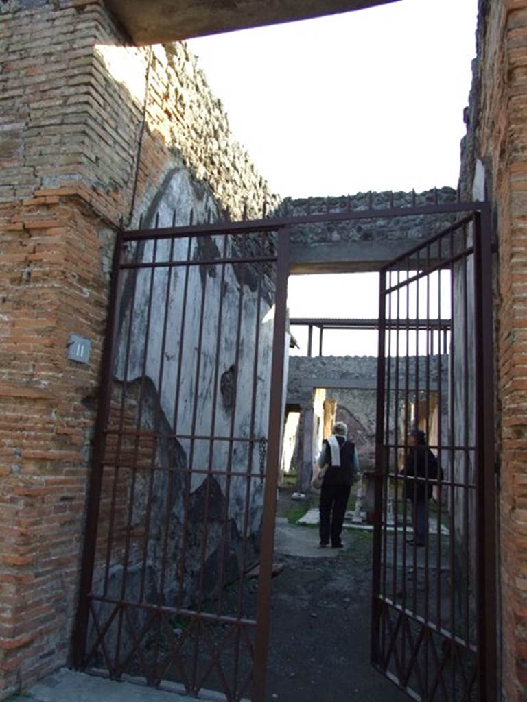 IX.5.11 Pompeii. December 2007. East wall of entrance corridor. According to NdS, like many others, this houses was ransacked, since its walls are almost all riddled with holes. 
See Notizie degli Scavi, 1877, (p.247)
