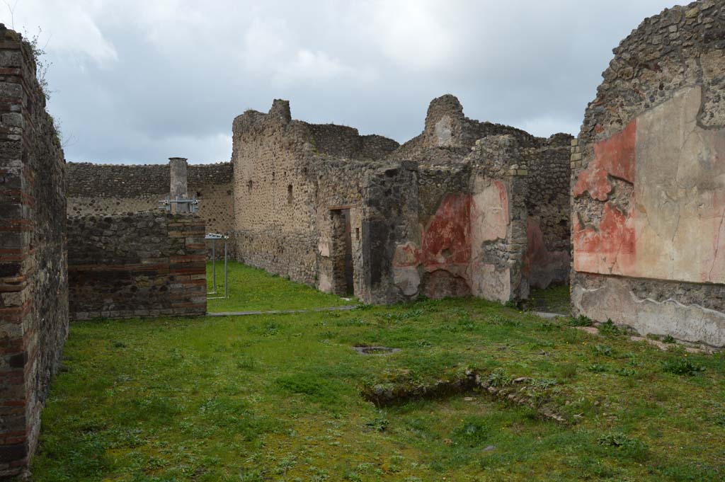 IX.5.14 Pompeii. March 2018. 
Looking north-west across impluvium in atrium towards portico k, with doorway to room L, in centre, and to triclinium f, on right. 
Foto Taylor Lauritsen, ERC Grant 681269 DCOR.


