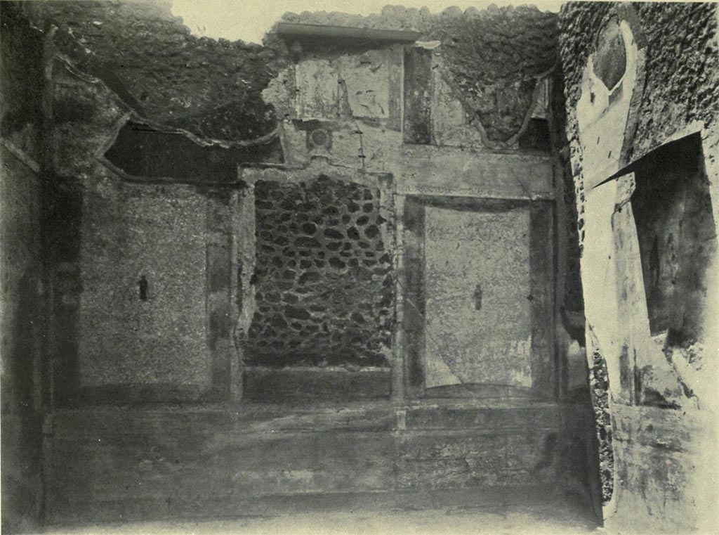 IX.5.18 Pompeii. Room f, west wall of large triclinium on west side of atrium, with north wall, on right.
See Van Buren, A. W. 1932. Further Pompeian Studies in Memoirs of American Academy in Rome, vol.10, (pl.10), and p.38-40.
Article by A. W. Van Buran, entitled “…..and he is bearing the babe Dionysus”.

