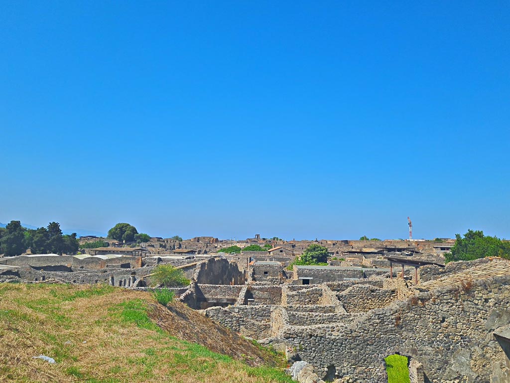 IX.7.12 Pompeii. June 2024. 
Looking west from above IX.7.12, rear of Casina dell’Aquila, from near IX.7.20. Photo courtesy of Giuseppe Ciaramella.

