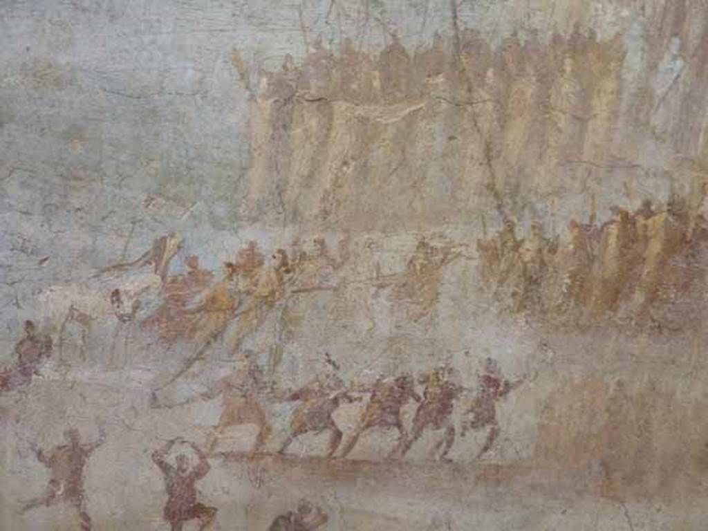 IX.7.16 Pompeii. Found on west wall of cubiculum on north side of entrance. Detail of painting of the Trojan Horse.  The Trojans drag the wooden horse to the walls of Troy. 
