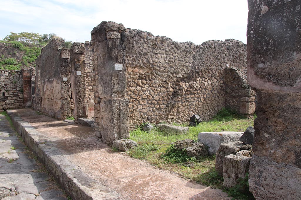 IX.7.23 Pompeii. October 2024. Looking south-east towards entrance doorway from roadway. Photo courtesy of Klaus Heese.