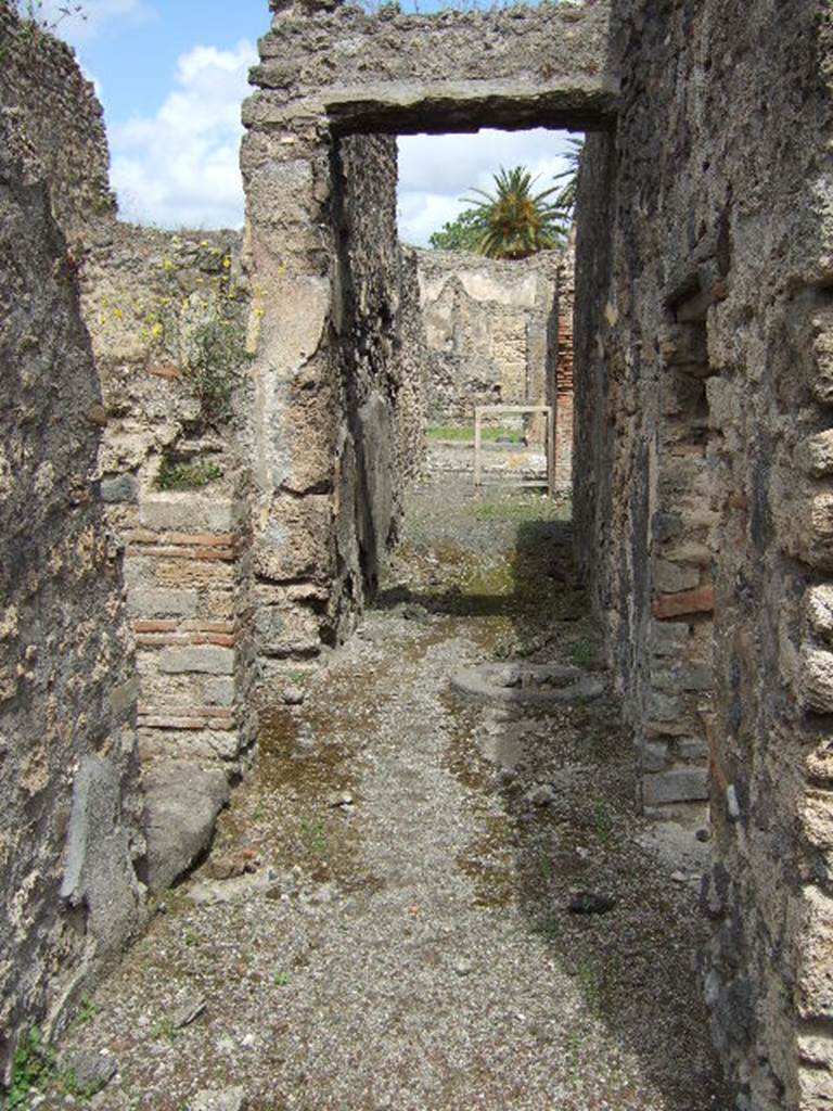IX.9.6 Pompeii. May 2006. Looking north along corridor, looking to entrance.