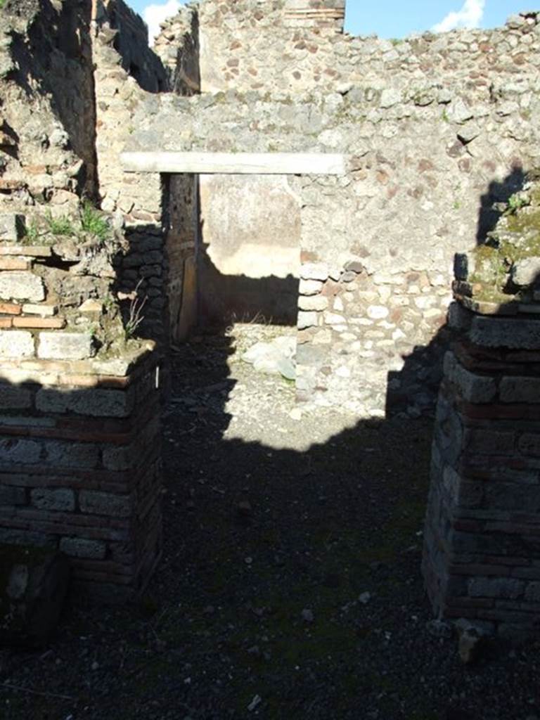 IX.9.a Pompeii.  March 2009. Looking east from outside Kitchen and Latrine.