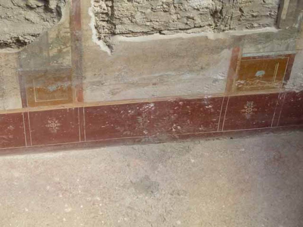 IX.12.9 Pompeii. May 2010. Room 2, lower east wall with painted plants.