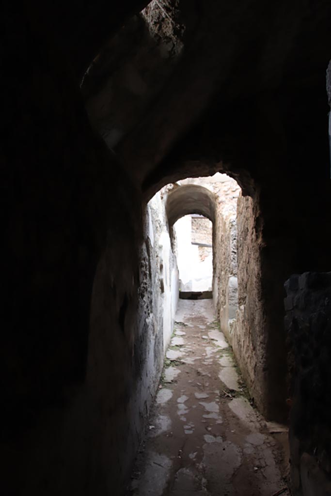 Villa of Diomedes, Pompeii. October 2023. 
Looking east along corridor 5,12 in north-east corner of portico. Photo courtesy of Klaus Heese.
