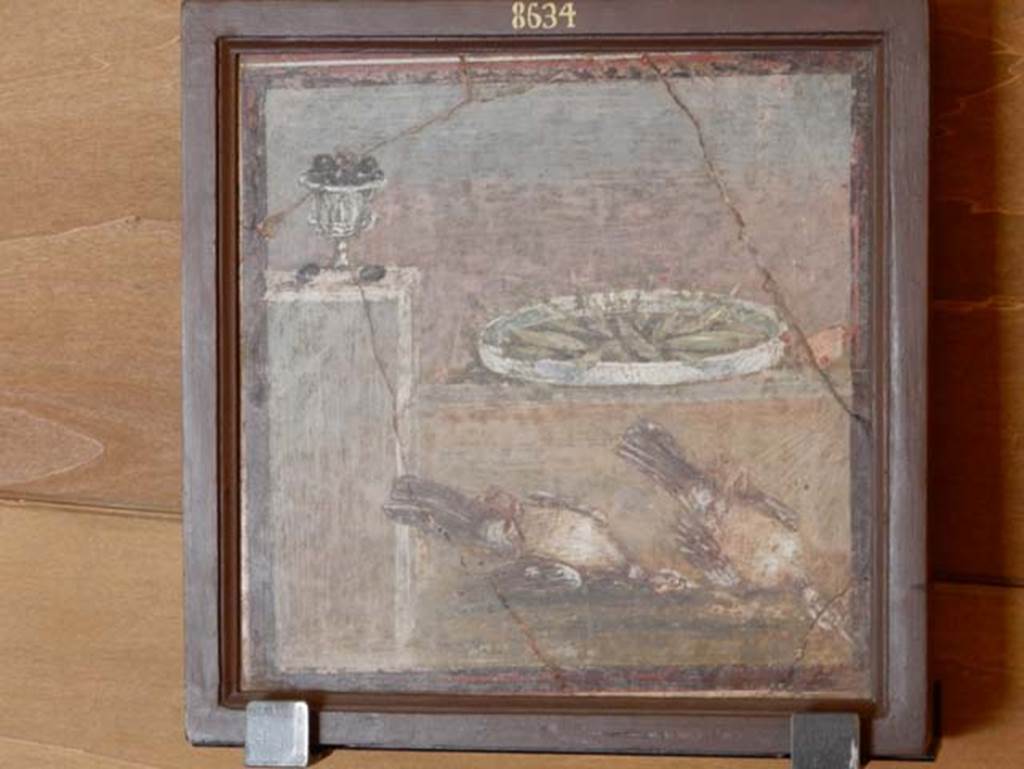 HGW24 Pompeii. May 2016. Painting of two pots filled with fruit and two dead birds, found 9th March 1771.
Now in Naples Archaeological Museum, inventory number 8634.  Photo courtesy of Buzz Ferebee.
Foodstuffs%20exhibit%20Ferebee%20May%202016%20DSCN8252