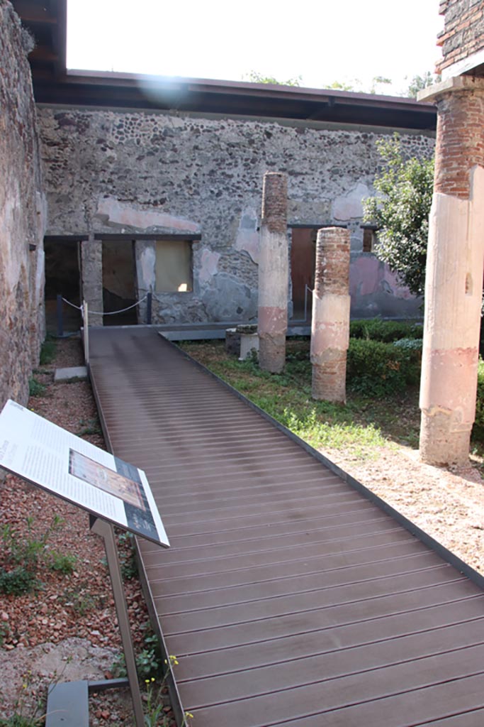 HGW24 Pompeii. December 2006. Looking north along west side of small triangular courtyard, part of baths complex. 