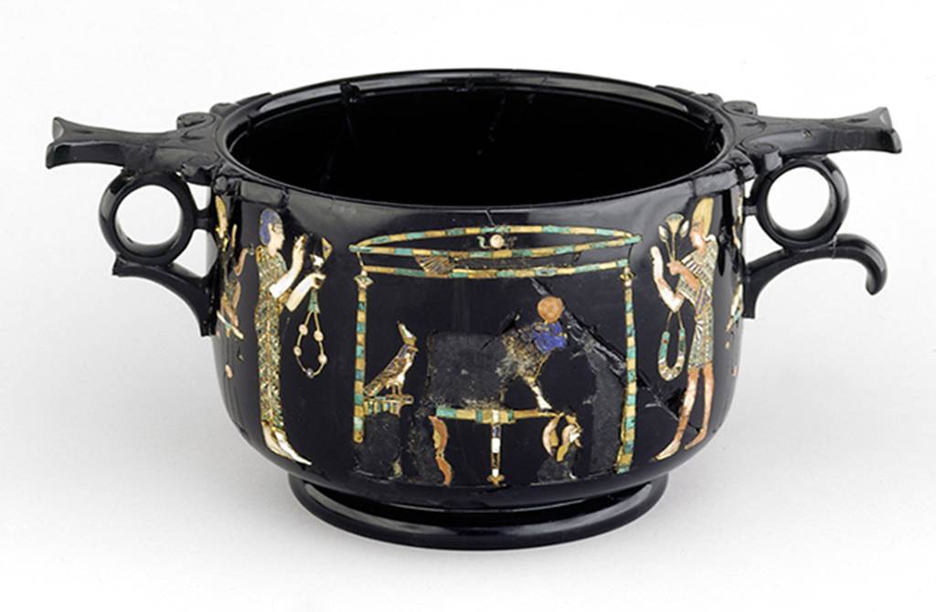 Castellammare di Stabia, Villa San Marco. Found May 1954, room 37, near the south east wall. Side of obsidian skyphos (cup) A with Egyptian scenes of bull worship inlaid in gold and mosaic.