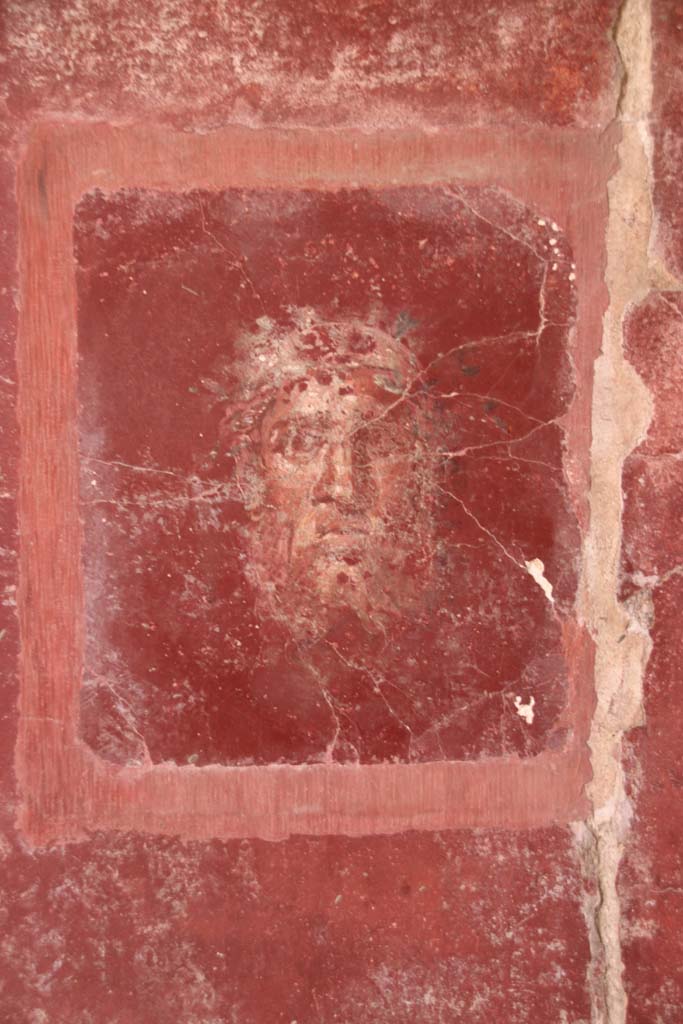 Villa San Marco, Stabiae, October 2020. 
Room 44, detail of painted face from east wall in south-east corner. Photo courtesy of Klaus Heese.


