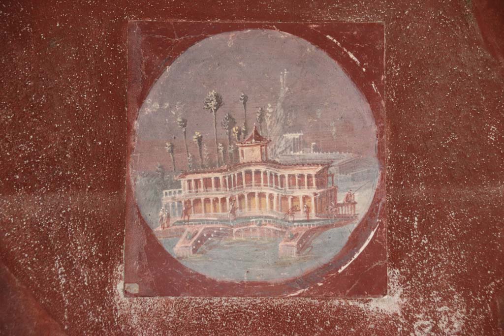 Villa San Marco, Stabiae, September 2021. 
Room 20, east wall, reproduction of medallion with a painted maritime villa. Photo courtesy of Klaus Heese.

