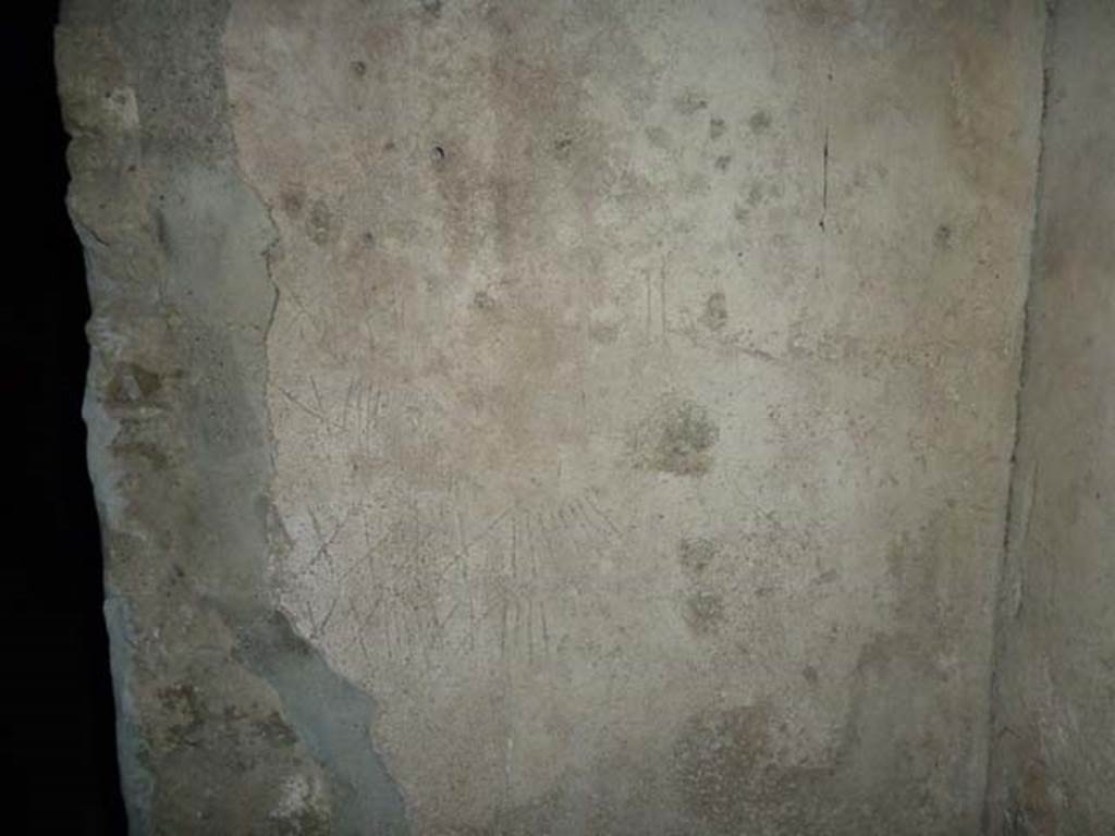 Villa San Marco, Stabiae, September 2015. Room 26, graffiti of Roman numerals on south wall in south-west corner of kitchen.