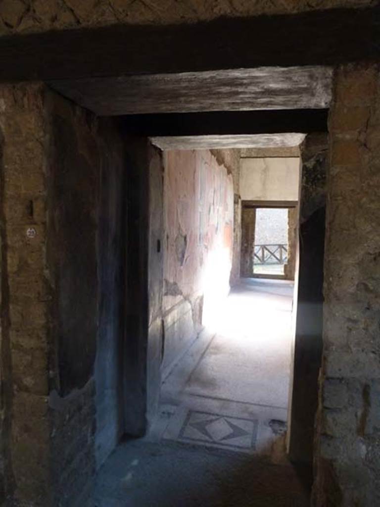 Villa San Marco, Stabiae, September 2015. 
Room 23, looking east through doorway to room 25, with mosaic threshold, from south-east corner of room 23.
