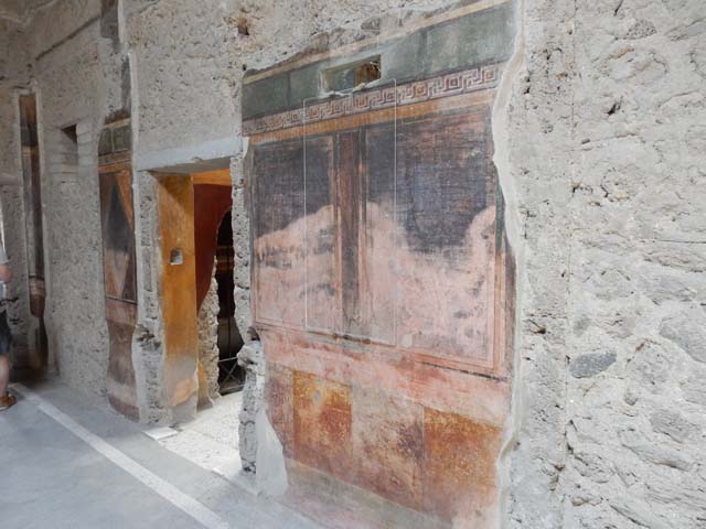 Villa of Mysteries, Pompeii. May 2015. Room 64, north wall of atrium towards north-west corner, and doorway to corridor F2. Photo courtesy of Buzz Ferebee.
