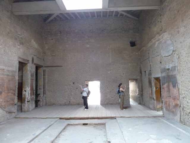 Villa of Mysteries, Pompeii. April 2005. 
Room 64, looking towards south-west corner of atrium, looking with doorways to corridor F1 and room 3 in south wall, on left.
Photo courtesy of Klaus Heese.
