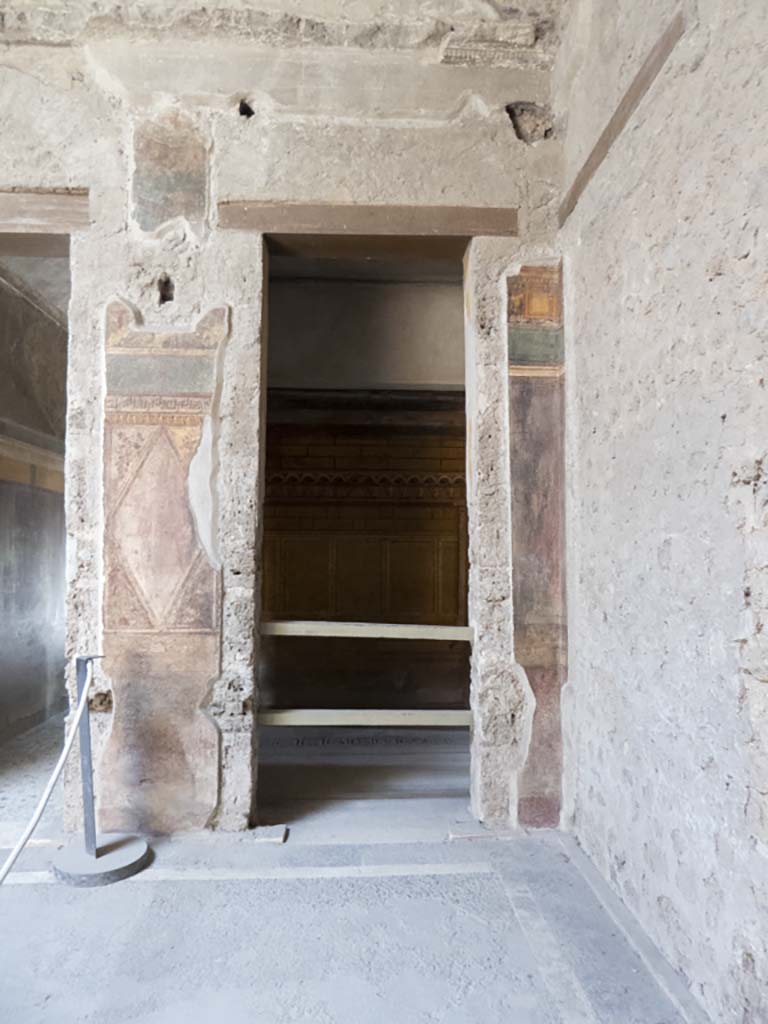 Villa of Mysteries, Pompeii. March 2019. 
Room 64, upper south wall with painted decoration between doorways to corridor F1, and room 3.
Foto Annette Haug, ERC Grant 681269 DÉCOR.
