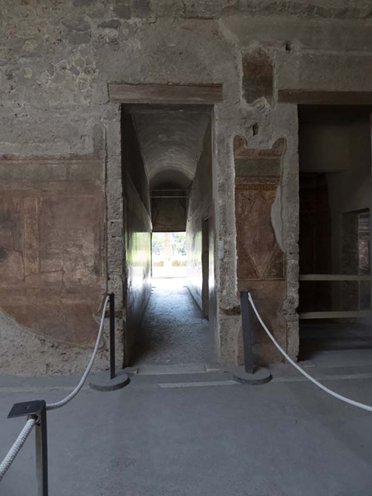 Villa of Mysteries, Pompeii. September 2017. 
Room 64, painted decoration on south wall between doorways to corridor F1, and room 3.
Foto Annette Haug, ERC Grant 681269 DÉCOR.
