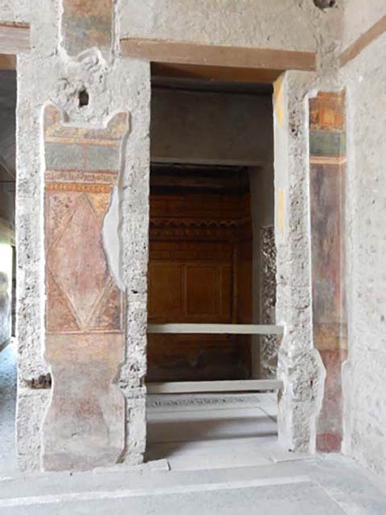 Villa of Mysteries, Pompeii. May 2015. Room 64, south-west corner of atrium.
Looking south through doorway into room 3. Photo courtesy of Buzz Ferebee.

