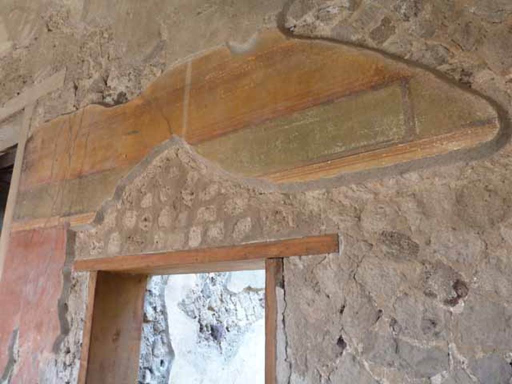Villa of Mysteries, Pompeii. May 2006. Painted wall above doorway to room 33.