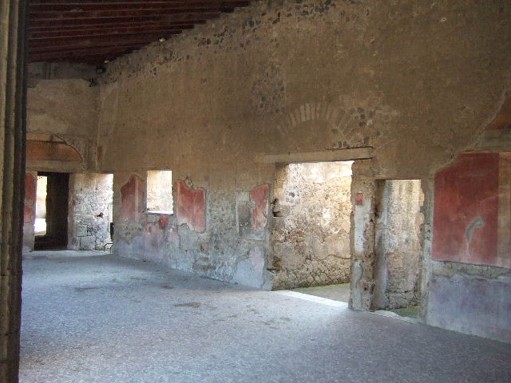 Villa of Mysteries, Pompeii. May 2006. Doorways to rooms 21, 26, Corridor 27, and room 28 on peristyle D. Looking west.
