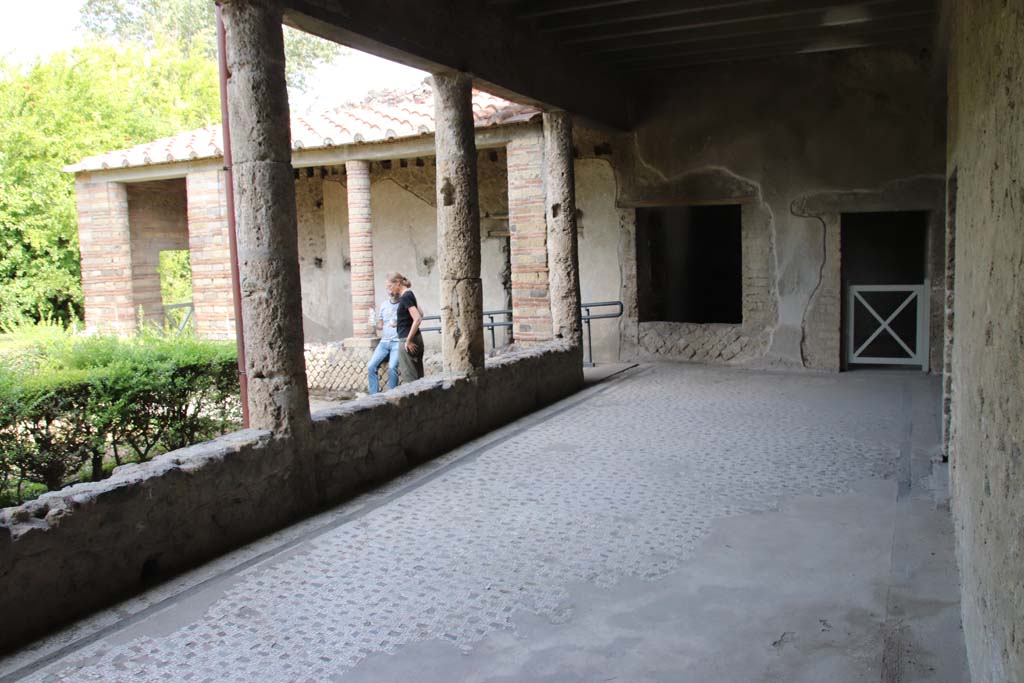 Villa of Mysteries, Pompeii. September 2021. 
Portico 4, looking towards south wall with doorway to corridor F2, and room 13. Photo courtesy of Klaus Heese.
