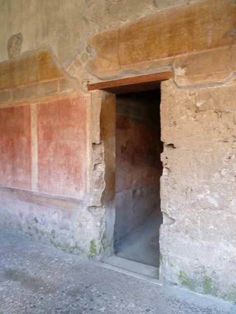 Villa of Mysteries, Pompeii. May 2010. Peristyle A, west wall with doorway to passage 7.