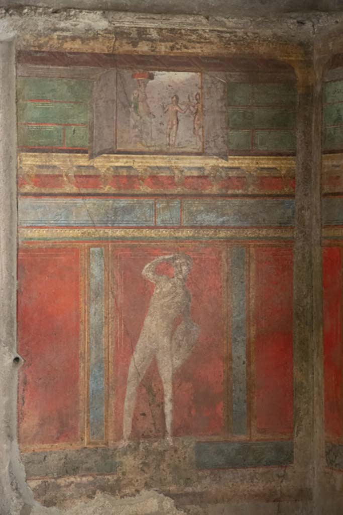 Pompeii. Villa of Mysteries. May 2006. Room 4, wall painting on west wall in north-west corner. The small upper panel shows a painting of a sacrifice.
