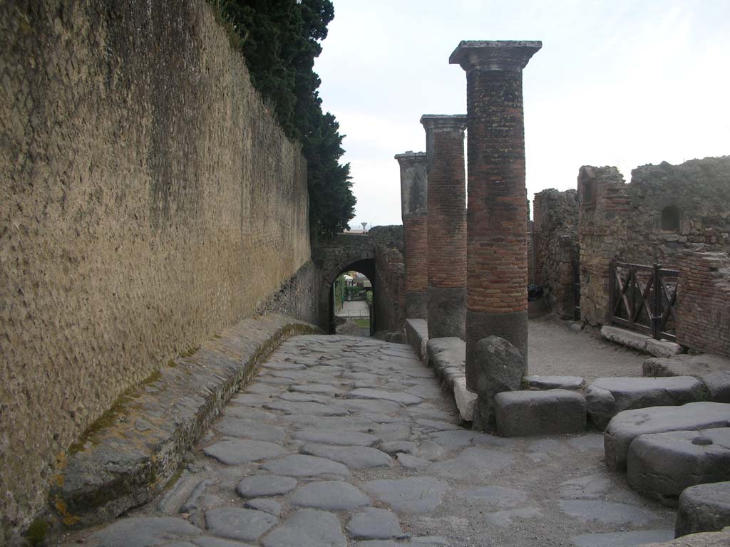Via Marina, Pompeii, on left. May 2011. 
Looking west along portico outside VII.16, on right, towards Porta Marina.Photo courtesy of Ivo van der Graaff.
