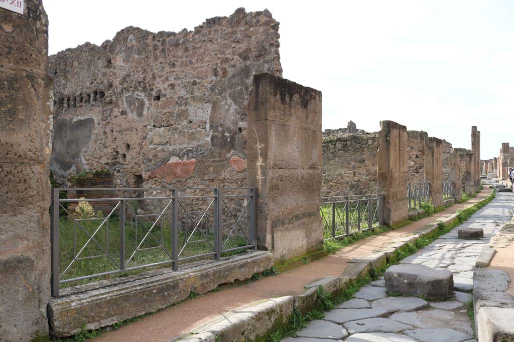 Via degli Augustali, Pompeii. December 2018. Looking west along south side, with VII.12.14, on left. Photo courtesy of Aude Durand.