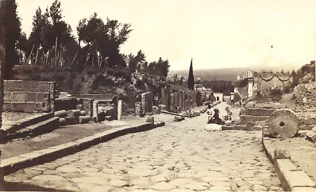 Via dei Sepolcri. Old postcard, c.1869. Looking north showing the east and west parts of Via Pomeriale. 
The entrance to the west part can be seen directly opposite to where the lady is sitting.
Photo courtesy of Rick Bauer.
