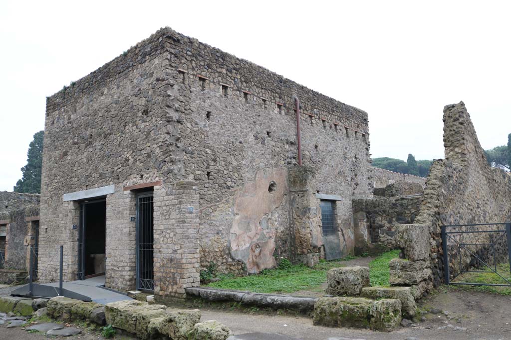 Via dell’Abbondanza, south side, Pompeii. December 2018. 
Looking south-east towards doorways II.4.3, II.4.2 and II.4.1. Photo courtesy of Aude Durand.
