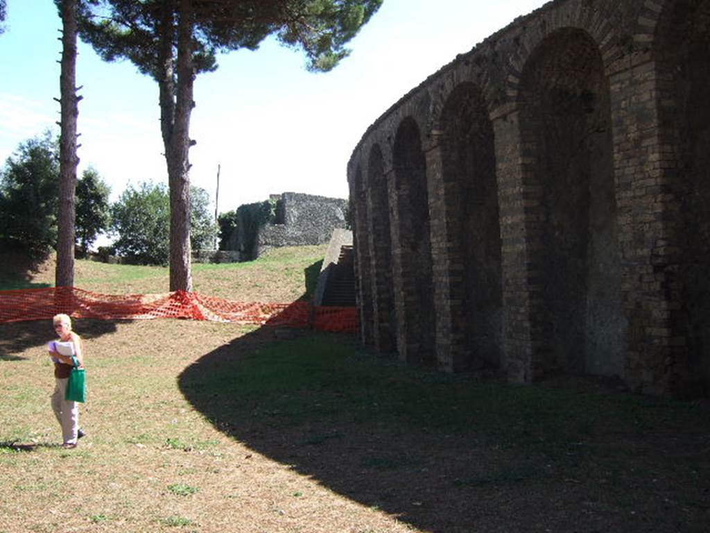 Amphitheatre at east end of Via di Castricio. September 2005. Looking east towards Tower VI. 

