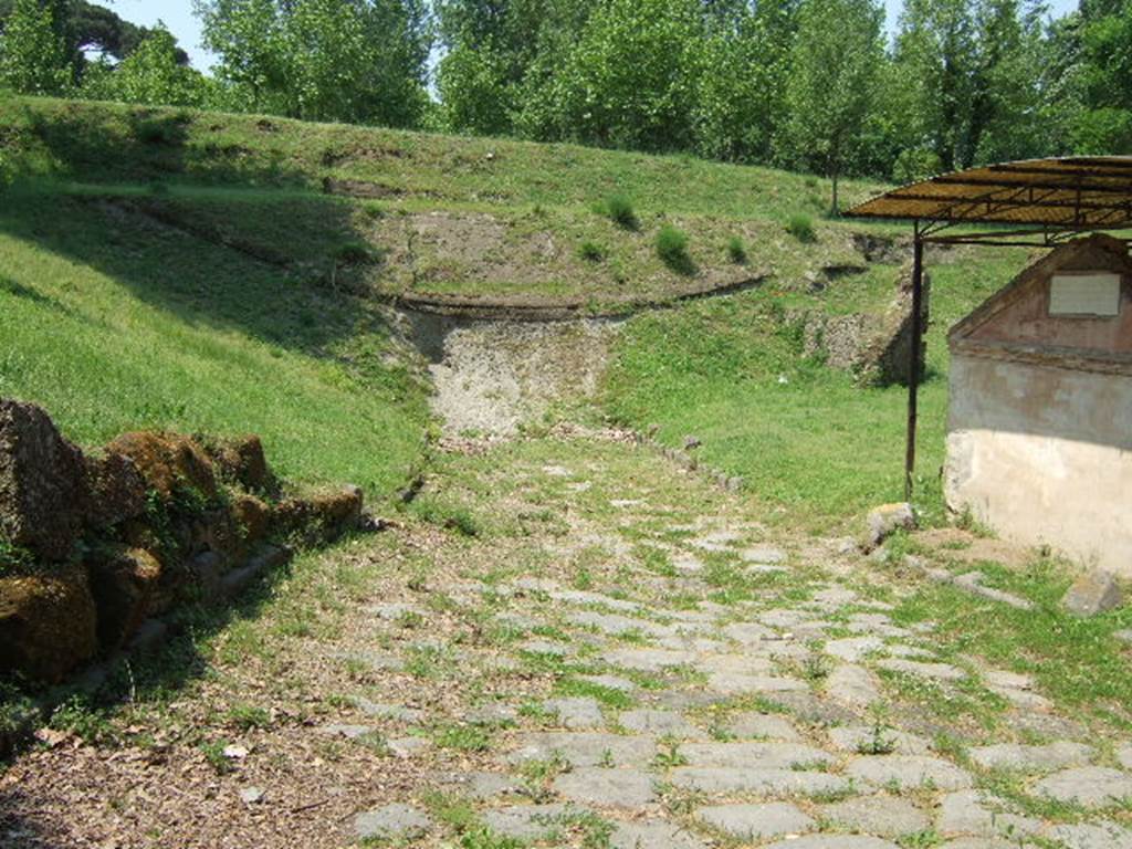 Ancient road outside city walls. May 2006. Road leading north into unexcavated lapilli showing surge layers of 79AD. 
