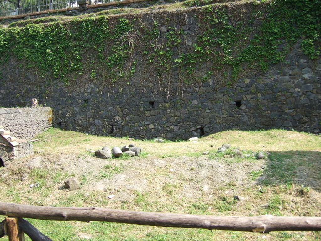Pompeii Porta Nocera. May 2006. Looking south.
Side wall of Tombs 23OS and 25aOS, on the left, and to Tomb 27OS, on the right. 

