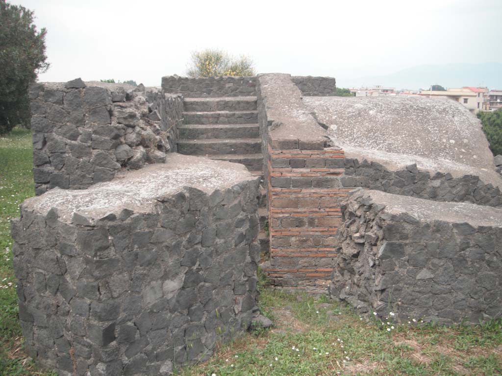 Tower V, Pompeii. May 2011. 
Looking through gap in south wall of tower towards steps on west inner side. Photo courtesy of Ivo van der Graaff.
