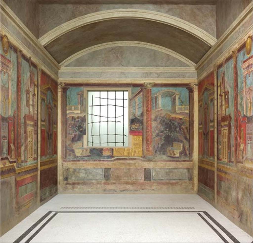 Villa of P. Fannius Synistor at Boscoreale. After the 2007 restoration and relocation. Cubiculum M and alcove with frescoes and mosaic floor. Note the position of the threshold mosaic strip dividing the alcove from the main room and the plain mosaic floor. The cubiculum was about six metres long, by four metres wide, and was divided into two parts, the room itself and an alcove. The room was two-thirds of all the space, the alcove occupied the rest at the rear. It was a real alcove, with the front ends ending in an arch closed with doors or curtains. The ceiling of the alcove was vaulted and with an arched rear wall, while the ceiling of the rest of the room was flat. The floor was marked with a dividing strip to separate the space where the bed was to be situated. This division almost simulated the threshold of another room. The floor was of white mosaic edged with two black bands in the room, and with pure white mosaic inside the alcove. The dividing strip, mimicking the threshold, was of coloured mosaic, striped with five rows, alternatively white and red, white and black. See Barnabei F., 1901. La villa pompeiana di P. Fannio Sinistore. Roma: Accademia dei Lincei. p. 72. Photo  The Metropolitan Museum of Art, Rogers Fund 1903. Inventory numbers 03.14.13a-g. See www.metmuseum.org