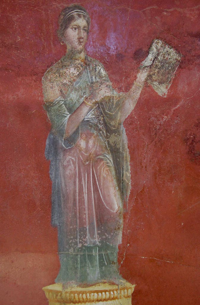 Complesso dei triclini in località Moregine a Pompei. September 2015. Triclinium A, north wall,
Clio the Muse of history, with a scroll.
