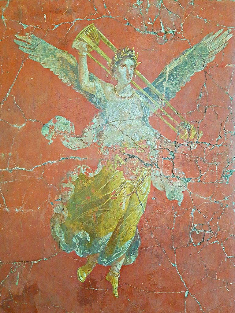 Complesso dei triclini in località Moregine a Pompei. September 2024. 
Triclinium C, east wall.
Vittoria con tripode. Vittoria with tripod, on display in Pompeii Palaestra.
Vittoria alata con gli attributi di Apollo. Winged Victory with the attributes of Apollo.
This is shown on the east wall of triclinium C but may have come from Triclinium D or E.
Photo courtesy of Giuseppe Ciaramella.
