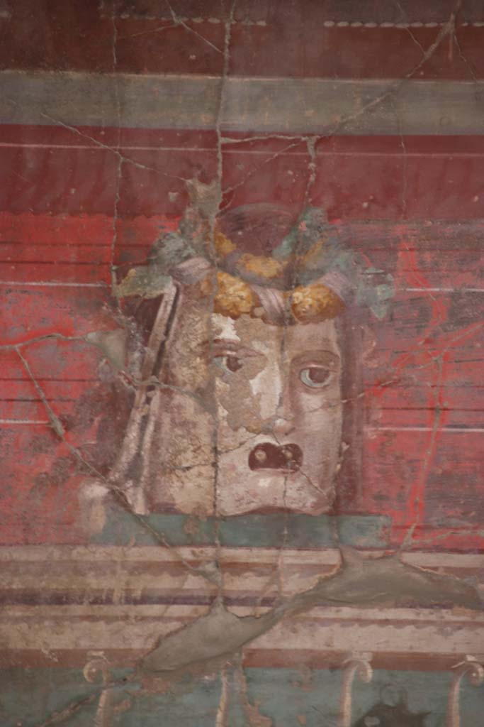 Oplontis Villa of Poppea, September 2021. 
Room 23, detail from mask in centre of west wall. Photo courtesy of Klaus Heese.

