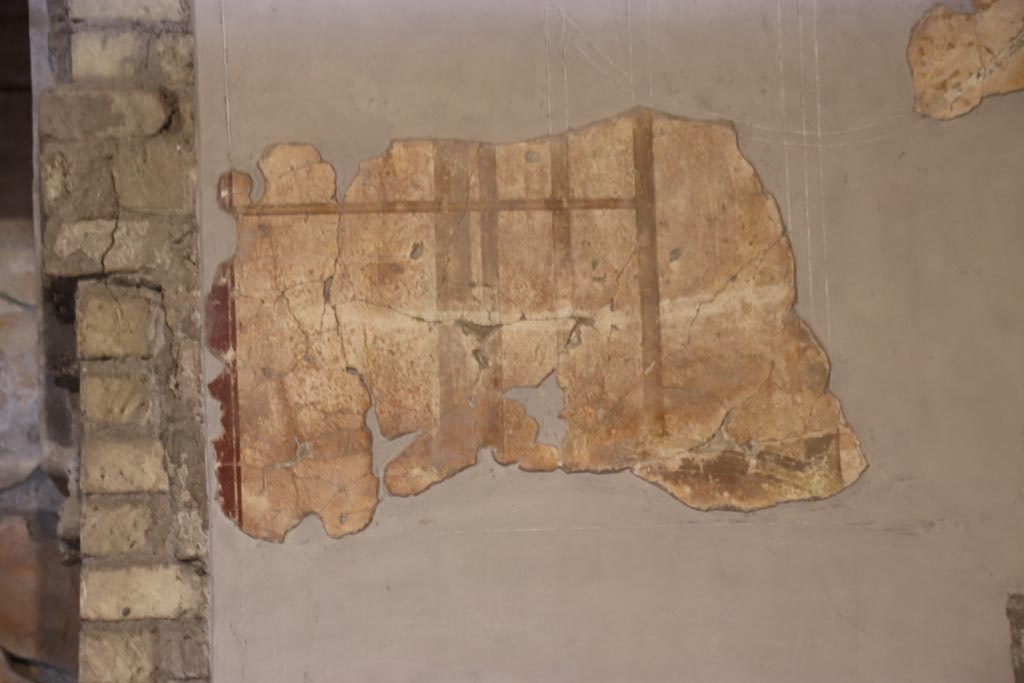 Oplontis Villa of Poppea, May 2024. Room 27, remaining painted decoration on west wall. Photo courtesy of Klaus Heese.